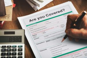 filling out insurance coverage form in revenue cycle management for healthcare