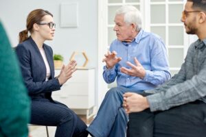 woman and older man having conversation about how to raise awareness for a cause